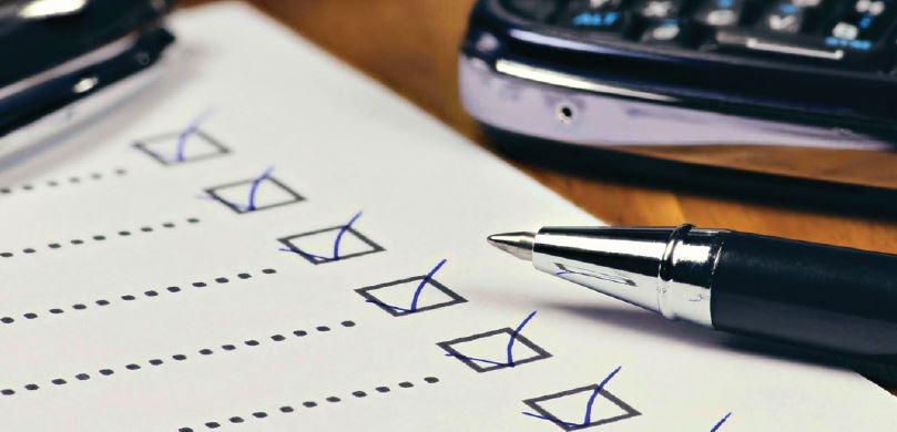 Image of checklist, pen and calculator
